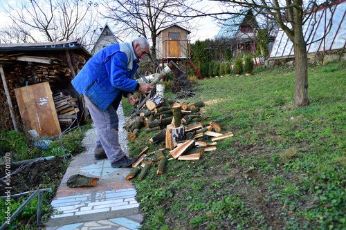 Traditional way of chopping wood with an ax in the village