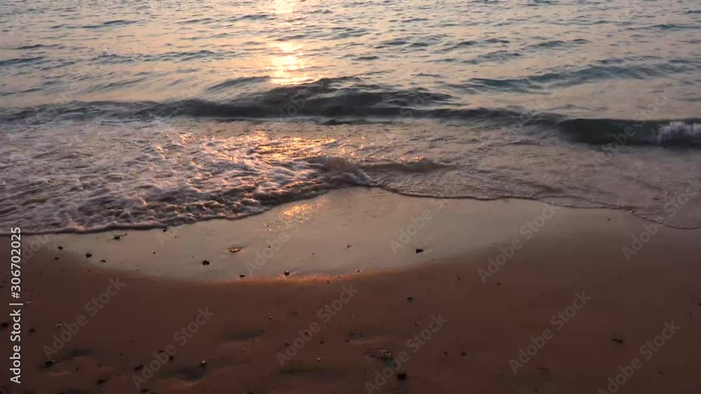 Early Evening Sunset on Beach, Big Wave in Ocean Top View, waves beat the sea foam on the sand on the beach Early Evening Sunset on Beach, Big Wave in Ocean Top View, waves beat the sea foam on the sand on the beach