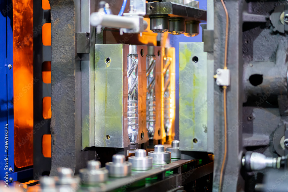 Manufacturing of bottles plastic line, bottle plastic hot blow injection process transportation raw material by automatic conveyor in the factory Manufacturing of bottles plastic line, bottle plastic hot blow injection process transportation raw material by automatic conveyor in the factory