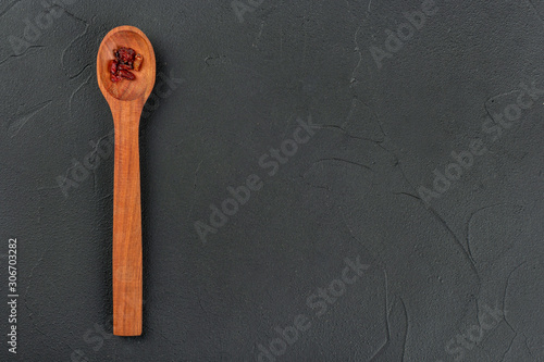 Dry barberry in spoon