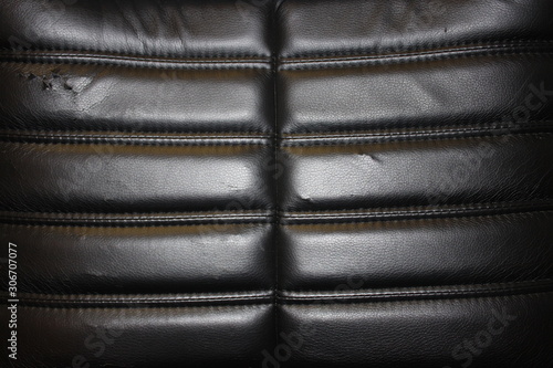 Bild auf Leinwand Old black leather stitched with threads. Moscow. Russia.