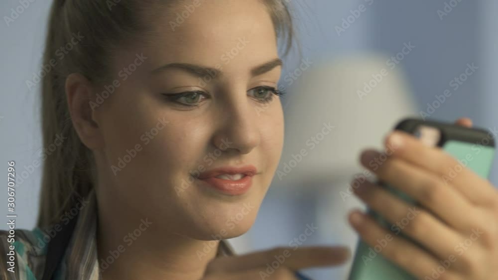 Woman online banking using smartphone shopping online with credit card Woman online banking using smartphone shopping online with credit card