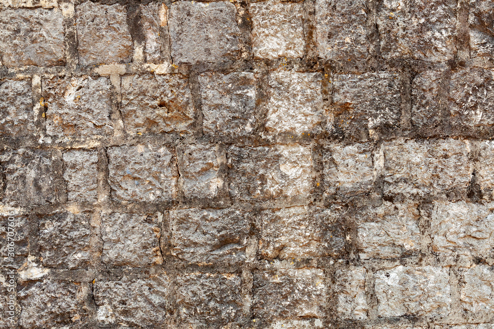 Naklejka premium old masonry, texture of stone wall, background Montenegro