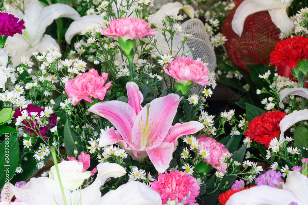 Fototapeta premium Carnation flowers and Chrysanthemum flowers in bouquet at flower market,pattern background,selective focus