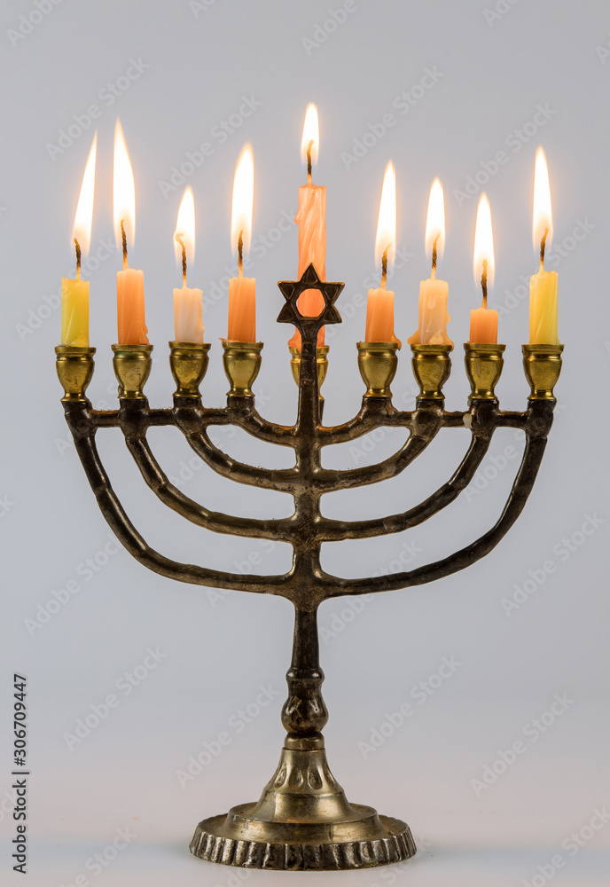 Closeup of a burning Chanukah candlestick with candles Menorah Closeup of a burning Chanukah candlestick with candles Menorah