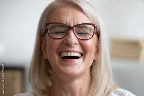 Close up portrait middle-aged attractive laughing woman
