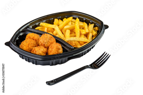 Closeup image of french fries and fried chicken in plastic disposable tray with fork isolated on white background