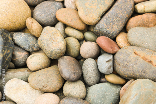 pebbles stone beach on the floor, pebbles stone background texture.