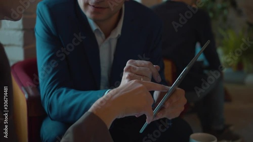 Business meeting, two partners discuss the documents