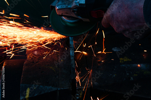 work as a grinder, metal cutting, sparks from metal cutting