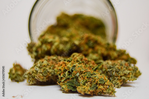 Dry and trimmed cannabis buds stored in a glass jar Medical cannabis