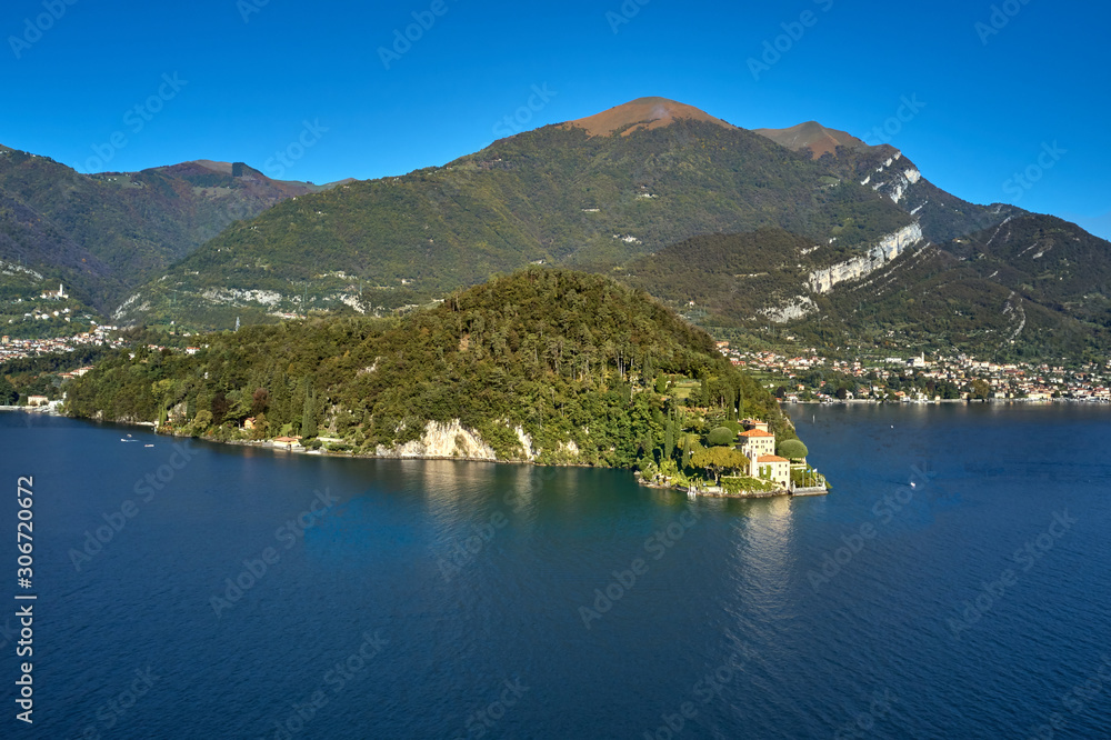 Panoramic top view of Lake Como. Lombardy, Italy. Villa del Balbianello, famous villa in the comune of Lenno. Autumn season. Perfect clear blue sky.