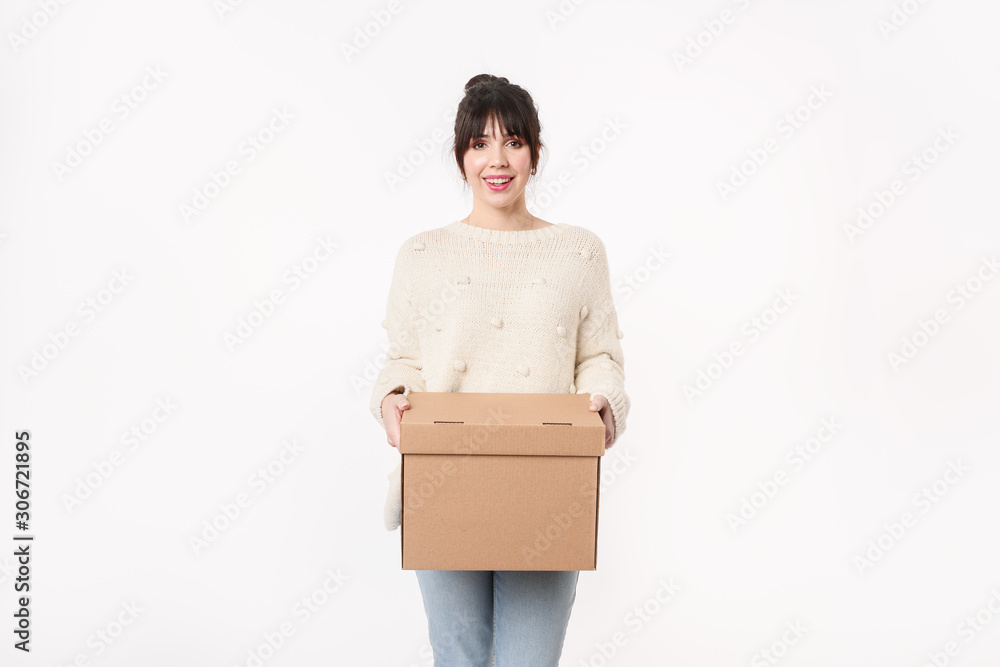 Smiling Delivery woman holding cardboard with online order and copy space for handwriting mockup. Moving day concept. Lay out home stuff for it's place. Smiling Delivery woman holding cardboard with online order and copy space for handwriting mockup. Moving day concept. Lay out home stuff for it's place.