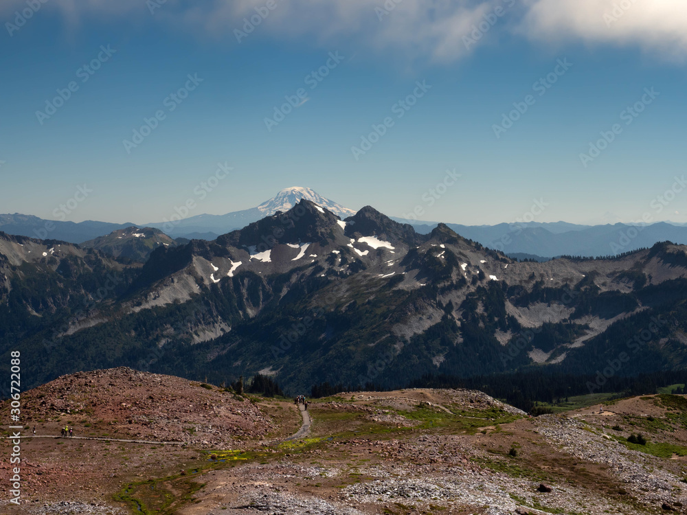 Fototapeta premium Mount Rainier and the Cascade Range with Reflection Lake and a Marmot