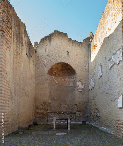 Apsidal room (Aula Absidata) in Palaestra in ancient Ercolano (Herculaneum) city ruins. photo