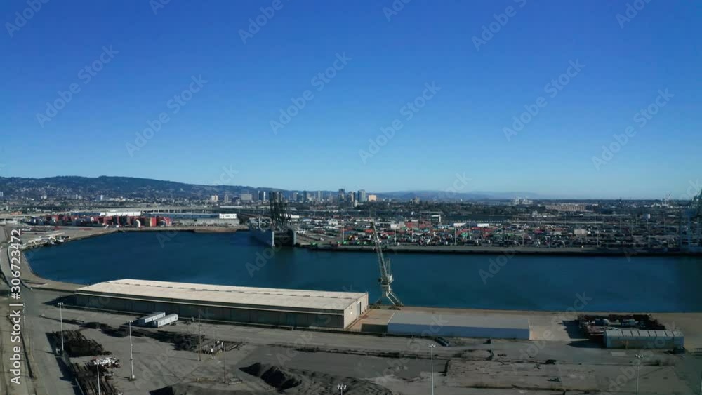 Blue sky over industrial cranes and a small boat. Blue sky over industrial cranes and a small boat.