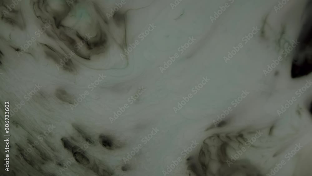 Surface of gas planet with whirlwinds and hurricanes is actually ink experiment shot top down. Cosmic gas implosion or edge of planet with twisters. Surface of gas planet with whirlwinds and hurricanes is actually ink experiment shot top down. Cosmic gas implosion or edge of planet with twisters.
