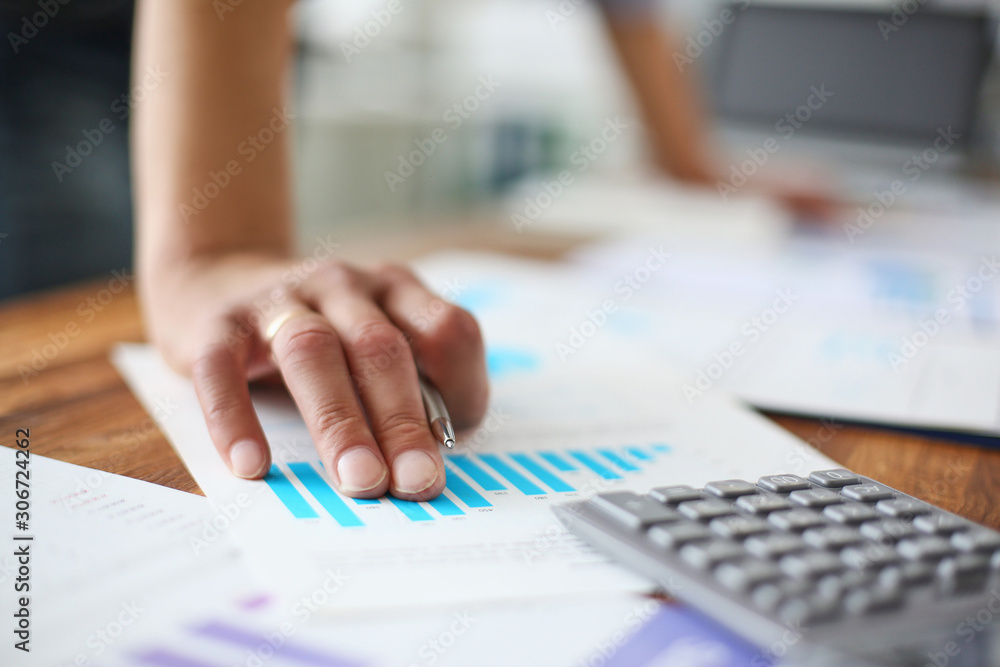 Image of male hand pointing with pen at business document during discussion at meeting close-up. Image of male hand pointing with pen at business document during discussion at meeting close-up.