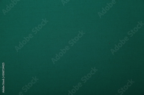 dark green fabric background with copy space for your text. seamless pattern. Color empty background.