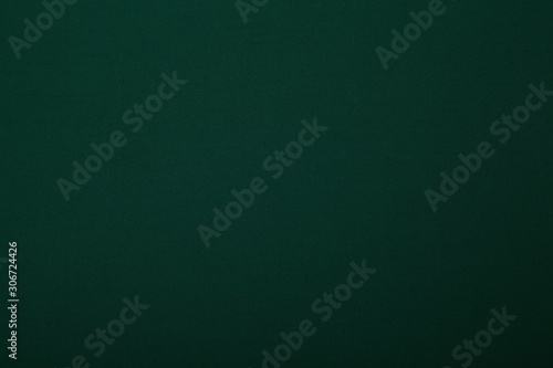 dark green fabric background with copy space for your text. seamless pattern. Color empty background.