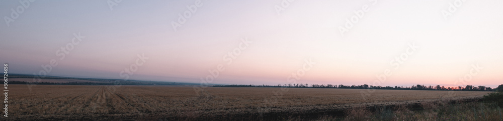 Panorama sunrise on field among the hills Panorama sunrise on field among the hills