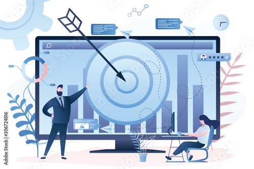 Male remarketing manager and female specialist put targeted ads.