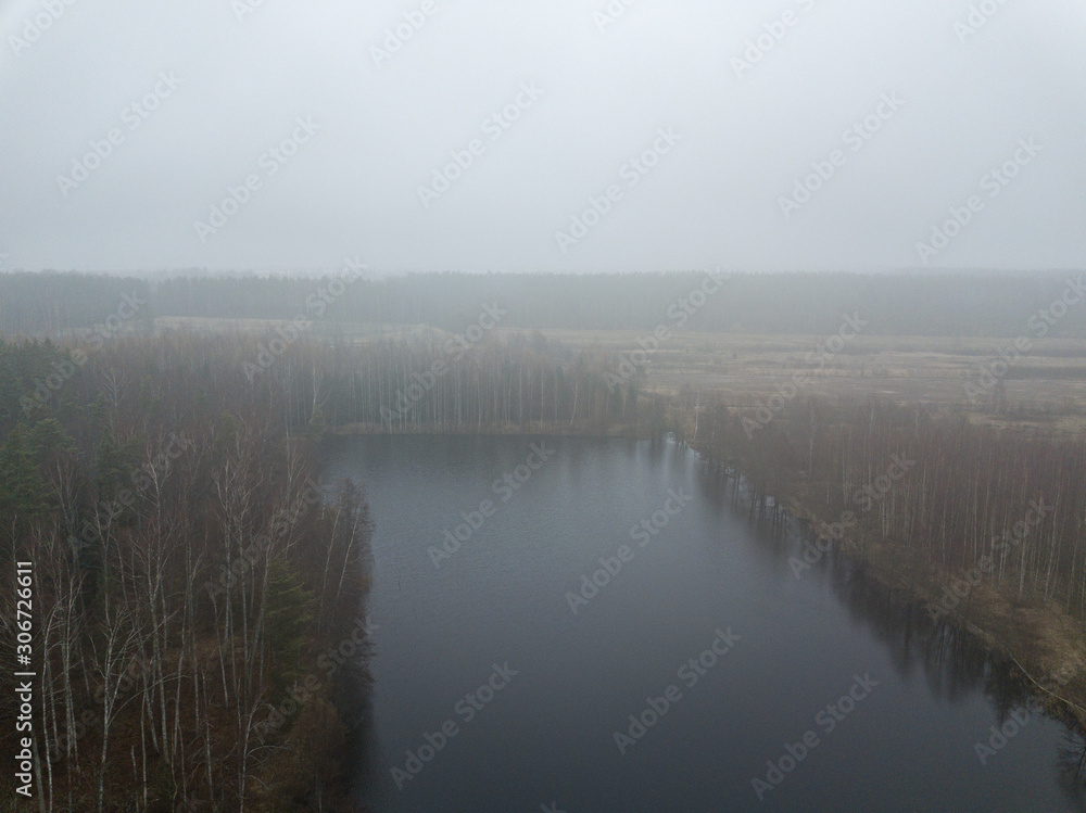 fog over forests and lakes in countryside. drone image from above fog over forests and lakes in countryside. drone image from above