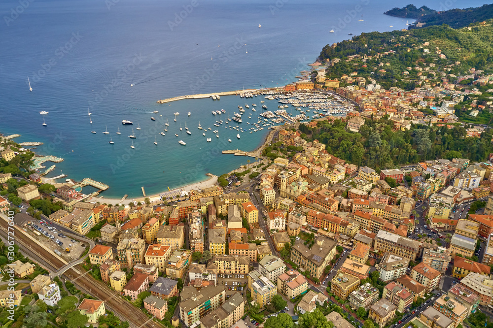 Aerial view of the harbor city of Santa Margherita Ligure, Italy. Yachts, boats, ships in the parking lot in the bay of the resort town. Early in the morning
