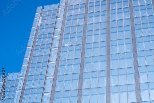 underside panoramic and perspective view to steel blue glass high rise building skyscrapers  business concept of successful industrial architecture