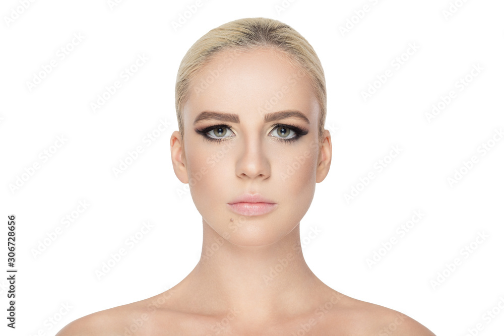 Close-up portrait of a blonde girl with makeup in studio light, with naked shoulders, looking at camera, isolated on white background. Close-up portrait of a blonde girl with makeup in studio light, with naked shoulders, looking at camera, isolated on white background.