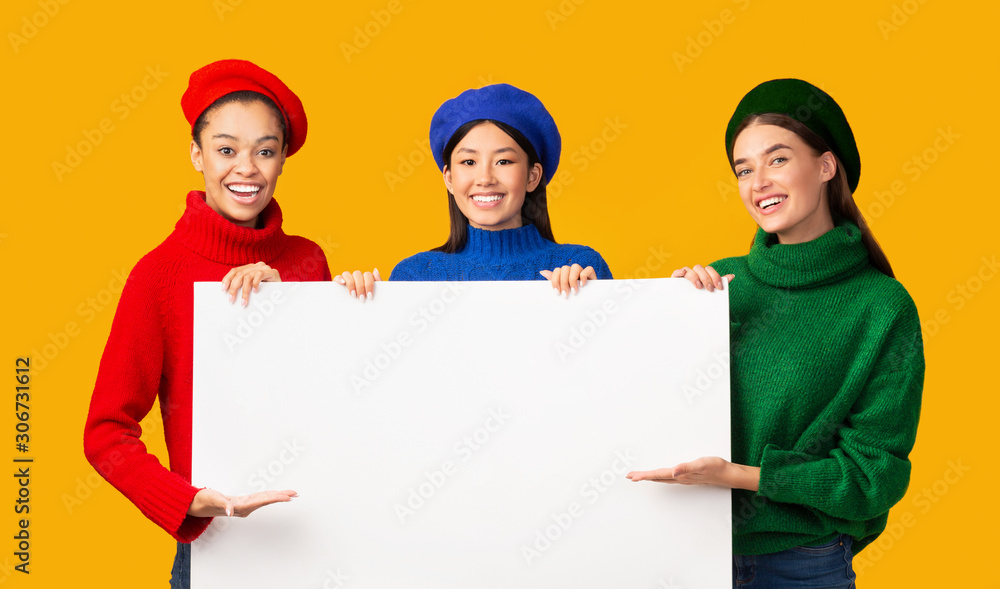 Three Diverse Girls Holding Blank White Board, Studio Shot Three Diverse Girls Holding Blank White Board, Studio Shot