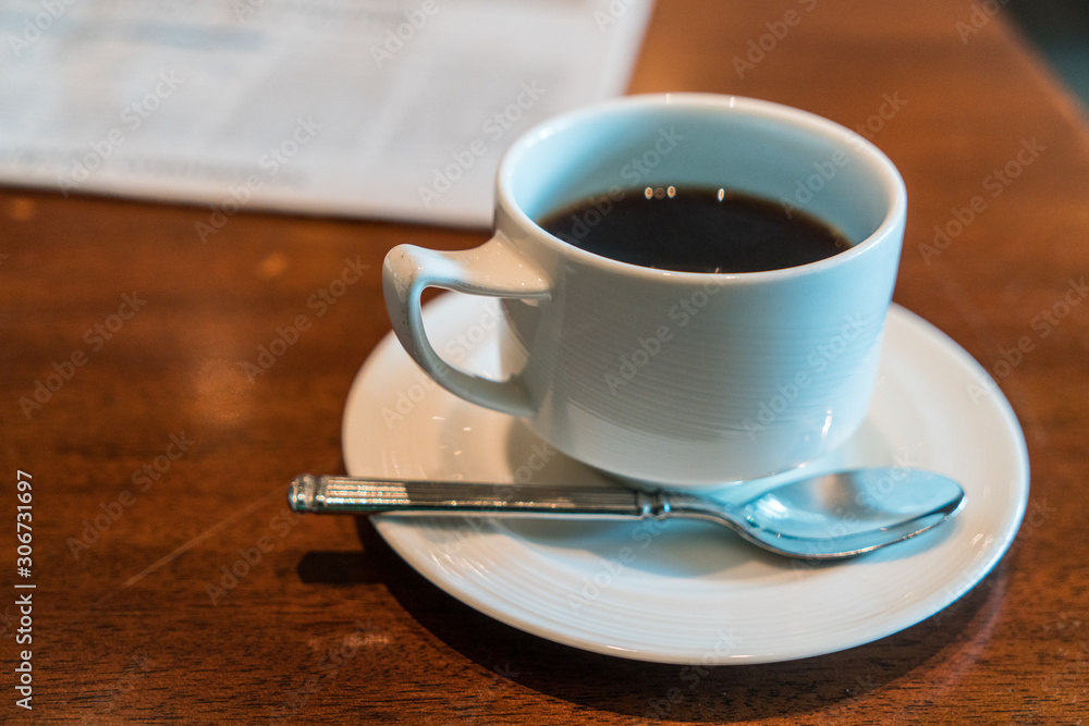 Black coffee on the table with business document. Black coffee on the table with business document.