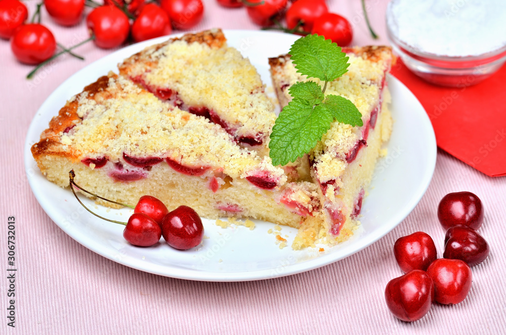 Czech baked souffle cake with cherries and mint leaves. Czech baked souffle cake with cherries and mint leaves.
