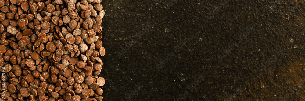 chocolate drops (black or milk chocolate, sweet ingredient) menu concept. food background. copy space. Top view chocolate drops (black or milk chocolate, sweet ingredient) menu concept. food background. copy space. Top view
