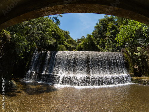 Waterfall and bridge photo