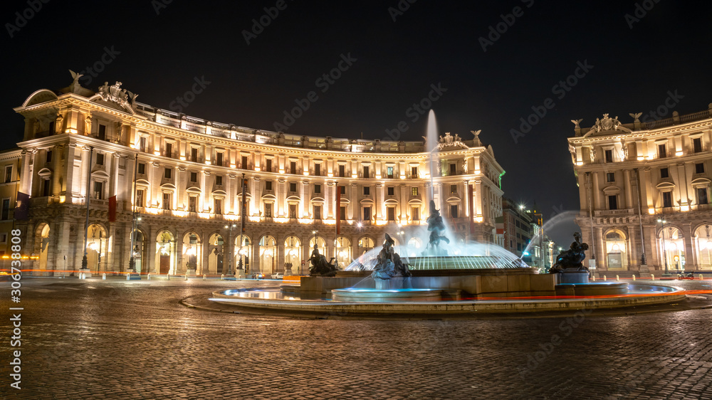 The Fountain of the Naiads and the Republic square in Rome at night.
