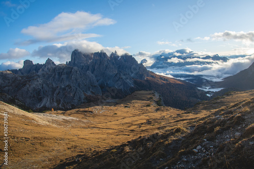 Dolomites, Italy, autumn sunset mountain landscape with clouds
