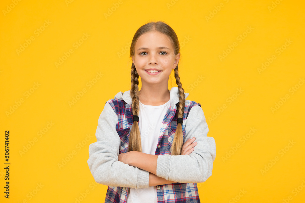 Casual style. Little girl yellow background. Good mood concept. Positive vibes. Self confidence. Cute braided girl. Kid long hair. Small girl checkered shirt. Happy international childrens day Casual style. Little girl yellow background. Good mood concept. Positive vibes. Self confidence. Cute braided girl. Kid long hair. Small girl checkered shirt. Happy international childrens day