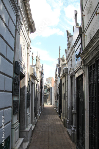 Fototapeta Naklejka Na Ścianę i Meble -  In an alley of the Recoleta cemetery in Buenos Aires, Argentina