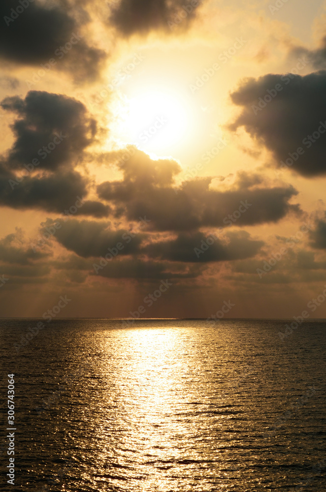 yellow sunset over the sea vertical