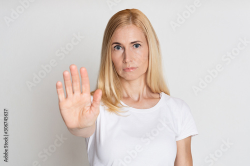 Wallpaper Mural No means no. Woman showing stop gesture Torontodigital.ca