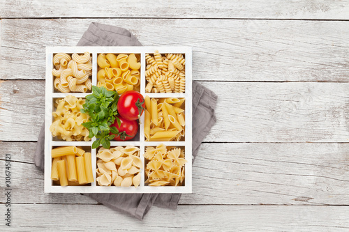 Various pasta in wooden box photo