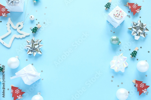 Christmas background with decorations and gift boxes on blue background