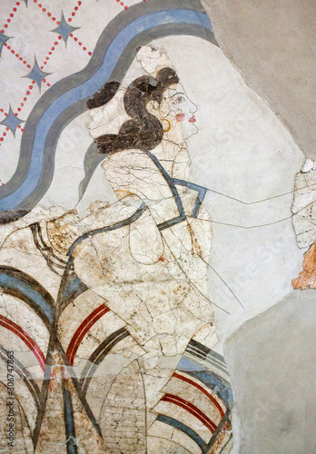 Wall painting of the ancient House of the Ladies depicting a female figure from Minoan Settlement of Akrotiri, located on the Santorini island, Cyclades, Greece photo