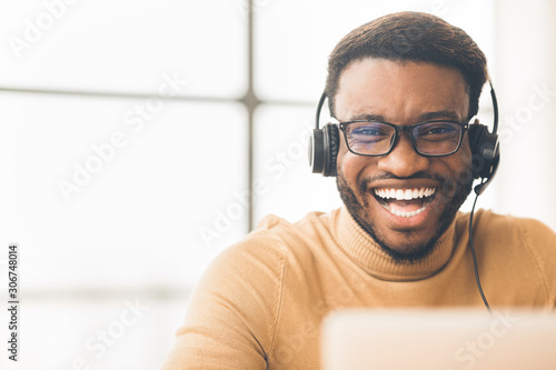 Closeup of happy african customer service agent