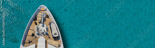Aerial drone top down ultra wide photo of luxury yacht nose docked in tropical exotic bay © aerial-drone