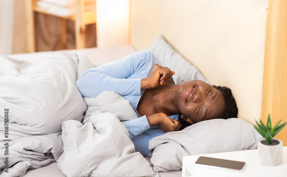 Smiling Black Girl Waking Up Lying In Bed At Home Smiling Black Girl Waking Up Lying In Bed At Home