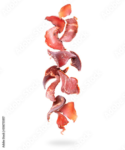 Fotografie Beef jerky pieces fall down on a white background