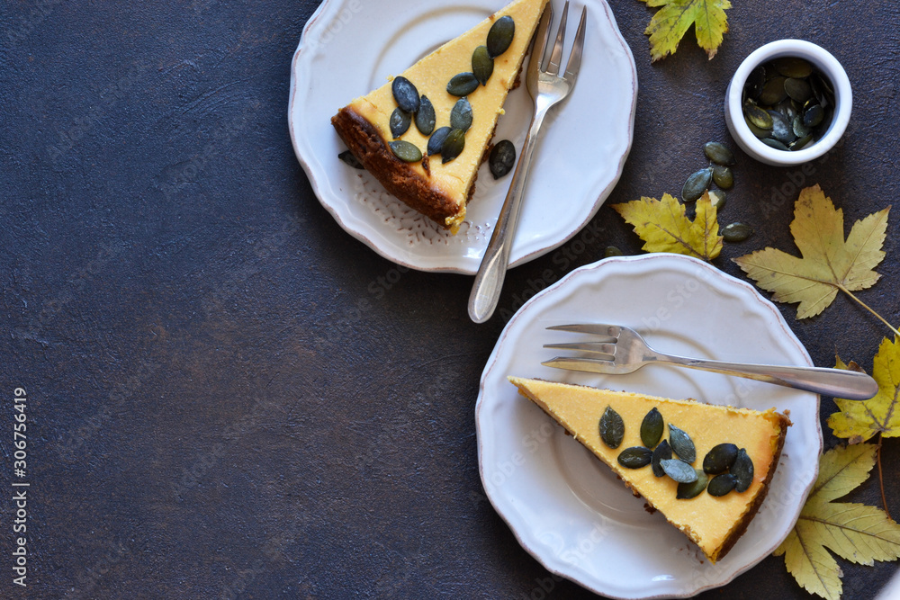 Pumpkin cheesecake on a concrete background. View from above. Pumpkin cheesecake on a concrete background. View from above.