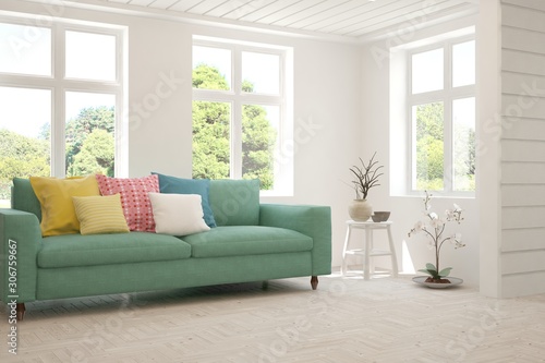 Stylish room in white color with sofa and summer landscape in window. Scandinavian interior design. 3D illustration